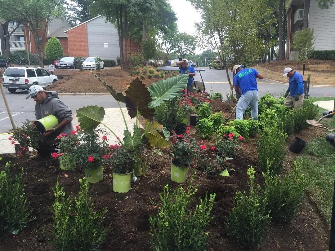 CKB crew installing new planting beds at an apartment community